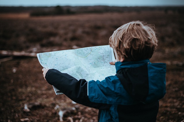 Child looking at map for directions