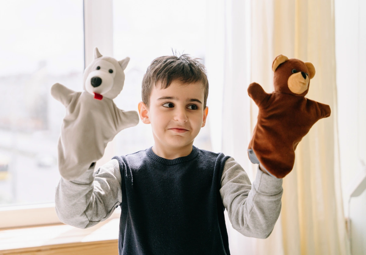A Boy in Gray Long Sleeves Playing Toys on His Hands - recovery order