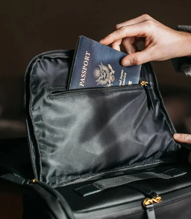 2026 parents passport australia putting a passport into a travel bag