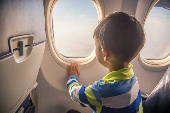 2026 Can I Stop My Ex Taking My Child Abroad Child looking out of a plane window